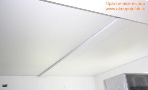 Обход балки натяжным потолком