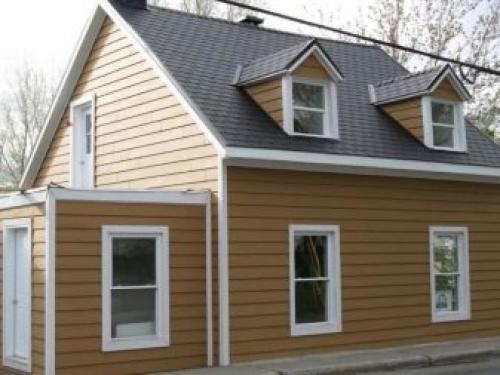 Как украсить фронтон дома. Материалы для обшивки стен чердака 09