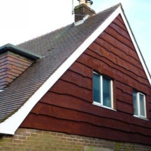 Как украсить фронтон дома. Материалы для обшивки стен чердака 06