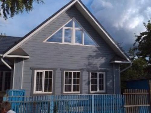 Как украсить фронтон дома. Материалы для обшивки стен чердака 10